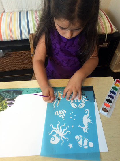 Art activity inspired by the book Over in the Ocean in a Coral Reef. Use stencils to paint an underwater scene with sea creatures, seashells, and coral. 