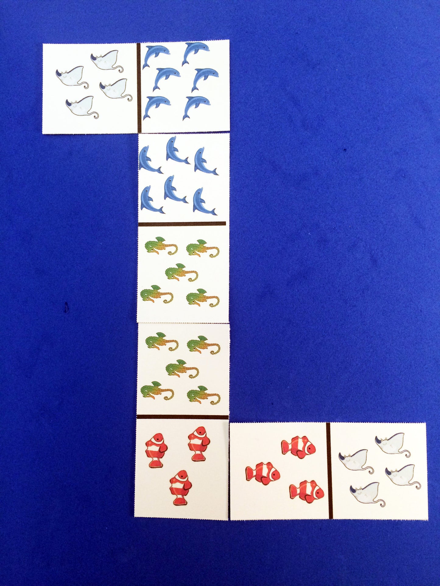 Sea Creature Dominoes, a math game inspired by the book Over in an Ocean in a Coral Reef.